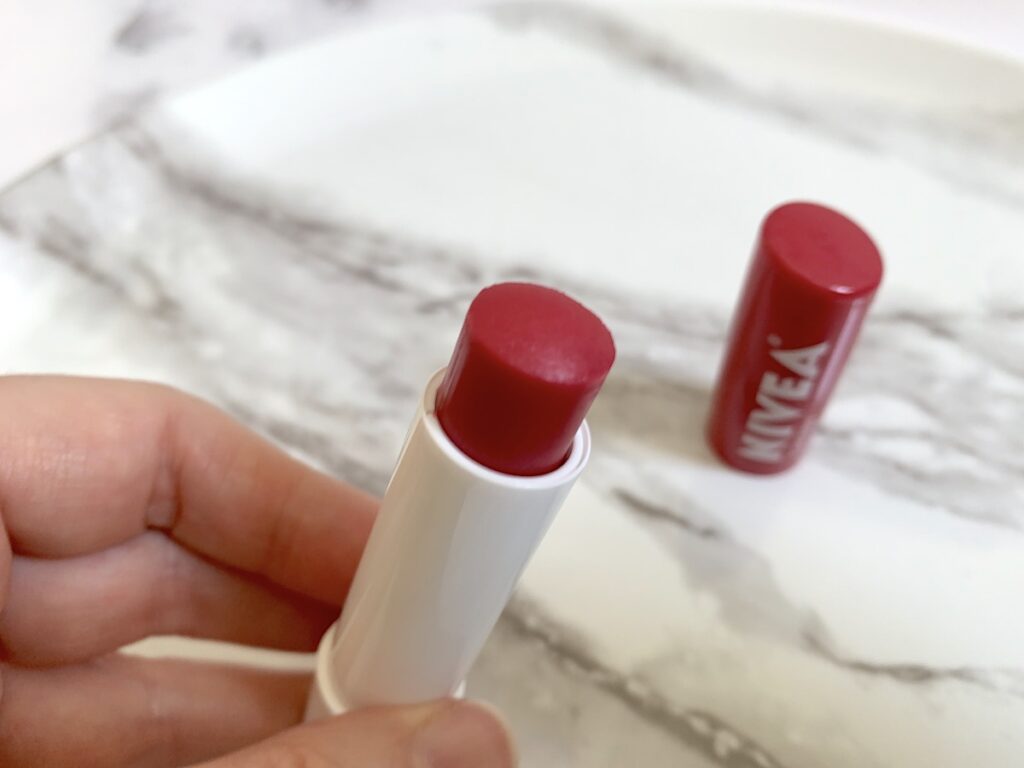 Nivea All-Day Nourishing Moisture Cherry Tinted Lip Care handheld.