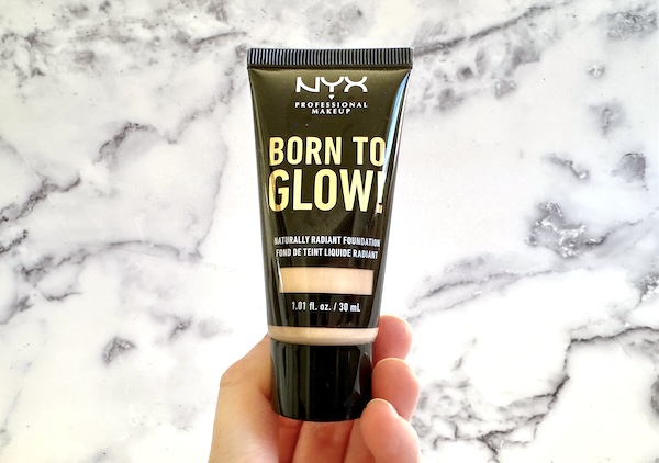 NYX Born To Glow Naturally Radiant Foundation in the shade Light Ivory, handheld.