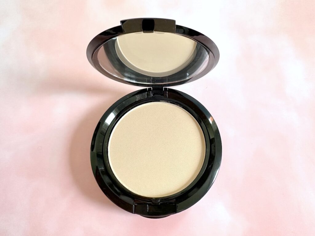 NYX Stay Matte But Not Flat Pressed Powder Foundation in the shade Medium Beige. Open compact flatlay.