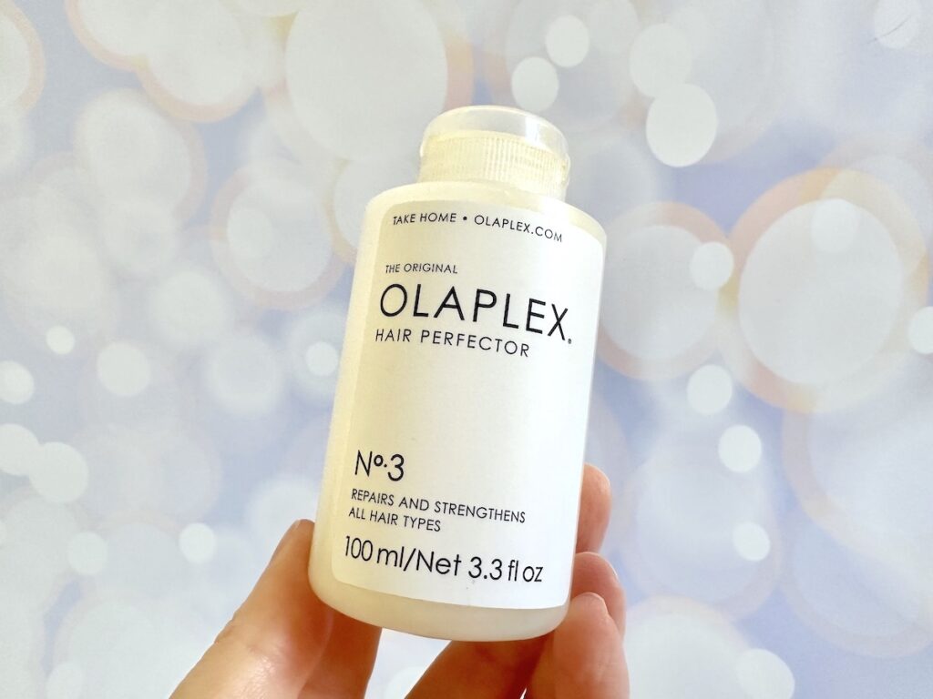 Olaplex No.3 Hair Perfector, handheld.