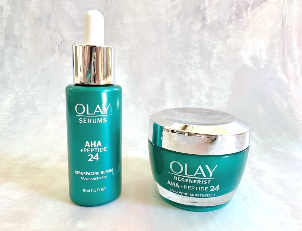 Olay AHA + Peptide 24 Serum and Moisturizer side by side.