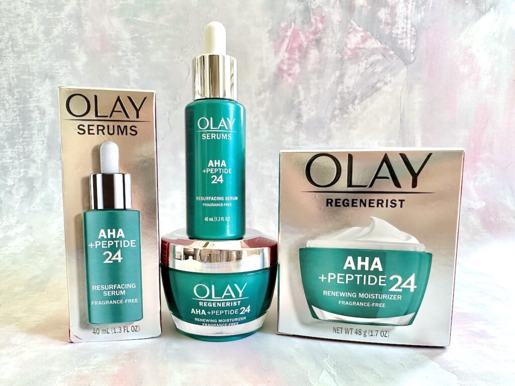 Olay AHA + Peptide 24 Review: AHA + Peptide 24 Serum and Moisturizer with boxes.