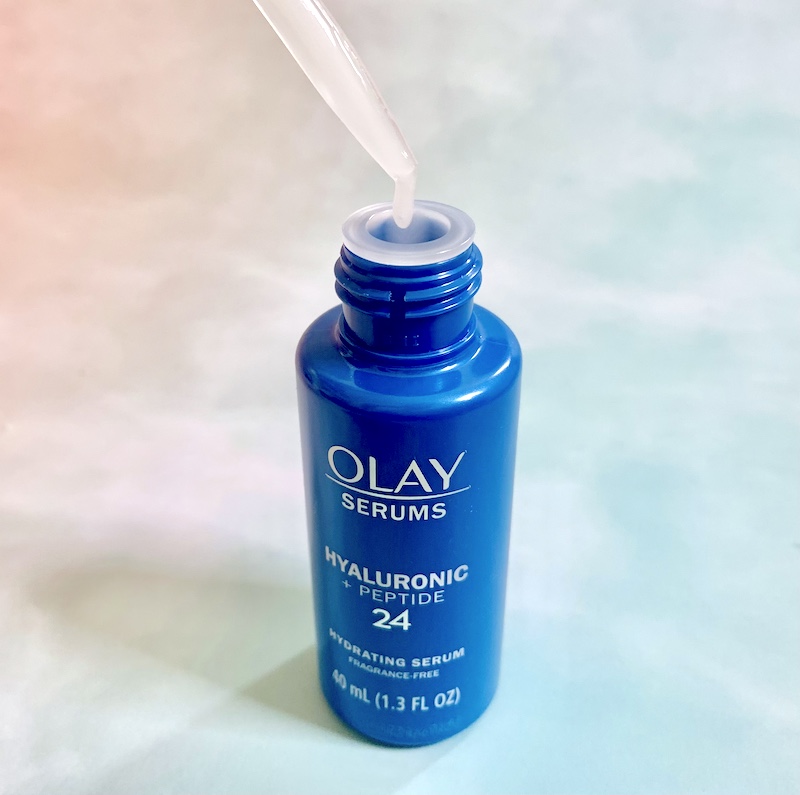 Olay Hyaluronic + Peptide 24 Serum open and sampled with dropper.