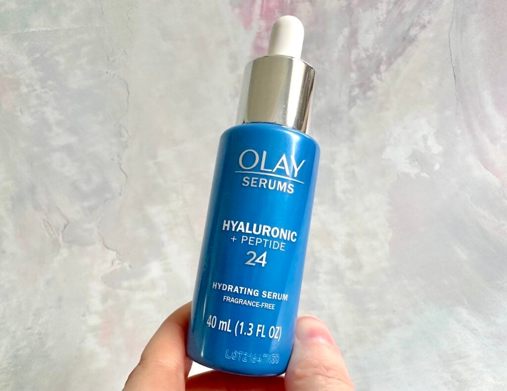 Olay Hyaluronic + Peptide 24 Serum, handheld.