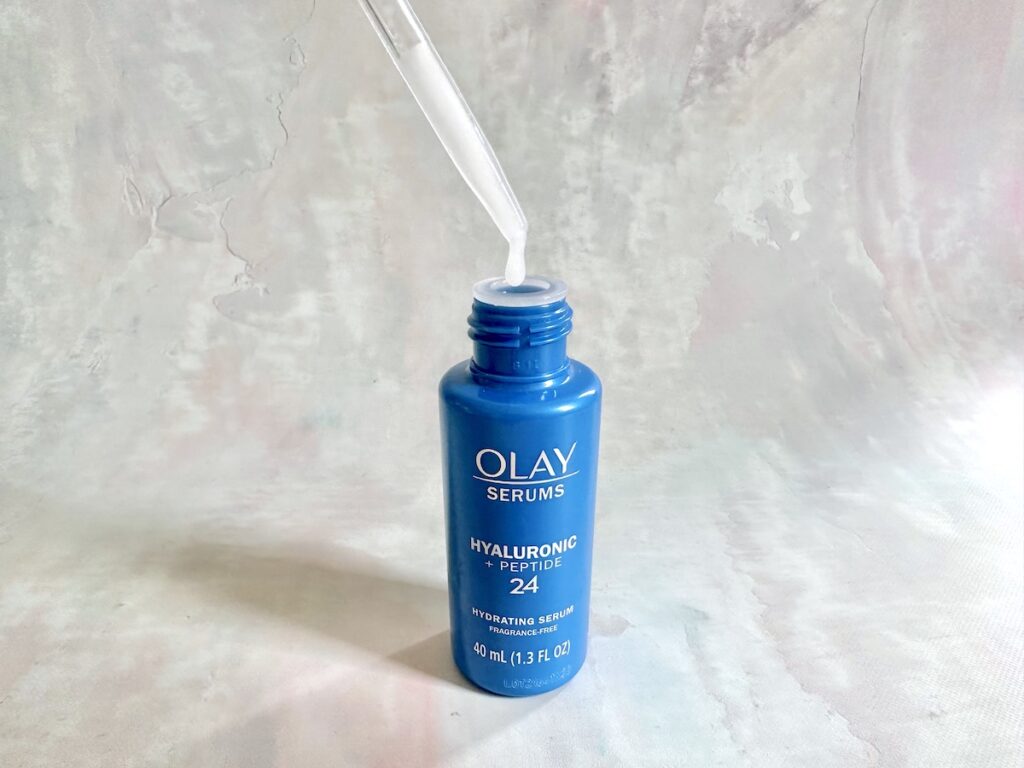 Olay Hyaluronic + Peptide 24 Serum, open bottle with dropper.