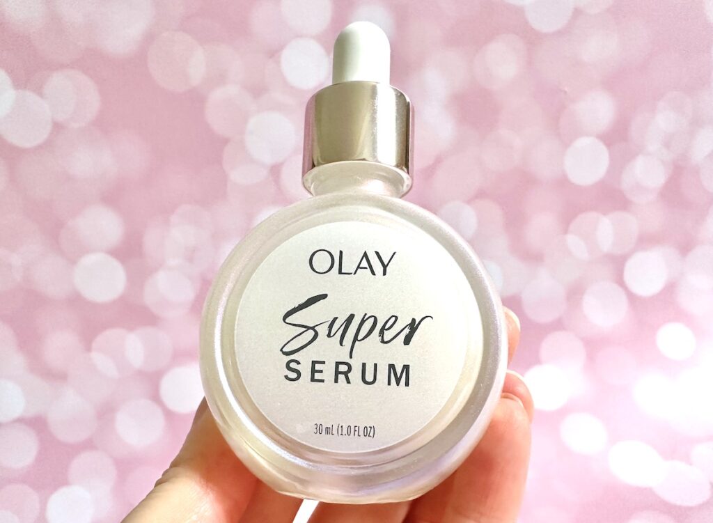 Olay Super Serum, handheld.