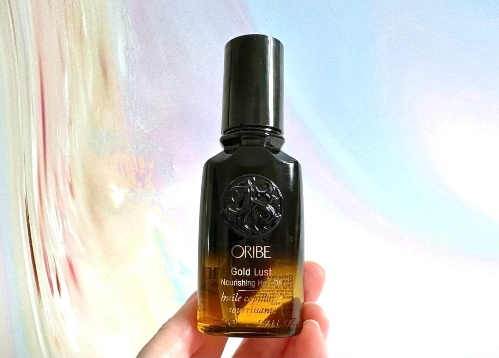 Oribe Gold Lust Hair Nourishing Oil, handheld.