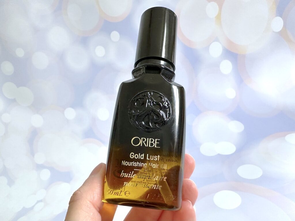 Oribe Gold Lust Nourishing Hair Oil, handheld.