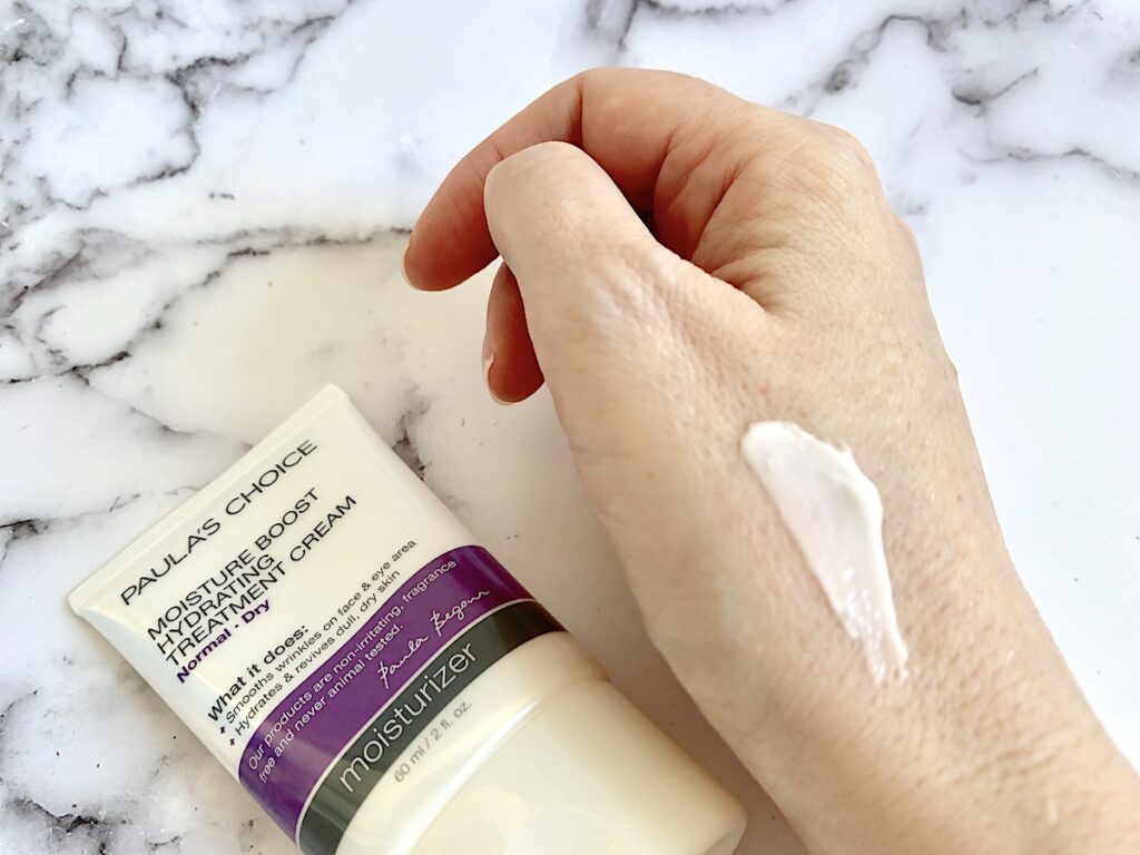 Paula's Choice Moisture Boost Hydrating Treatment Cream sampled on back on hand.