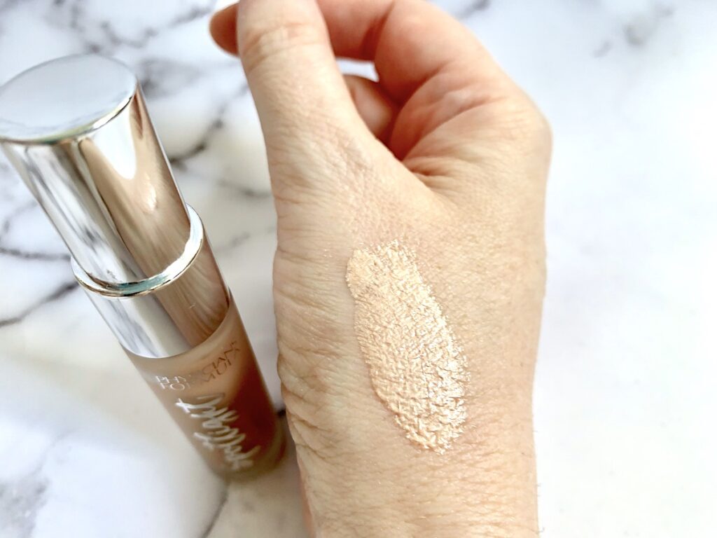 Physicians Formula Spotlight Illuminating Primer sampled on hand.