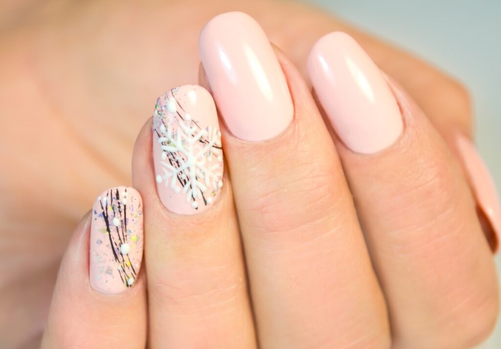 Pink blush snowflake winter nails.