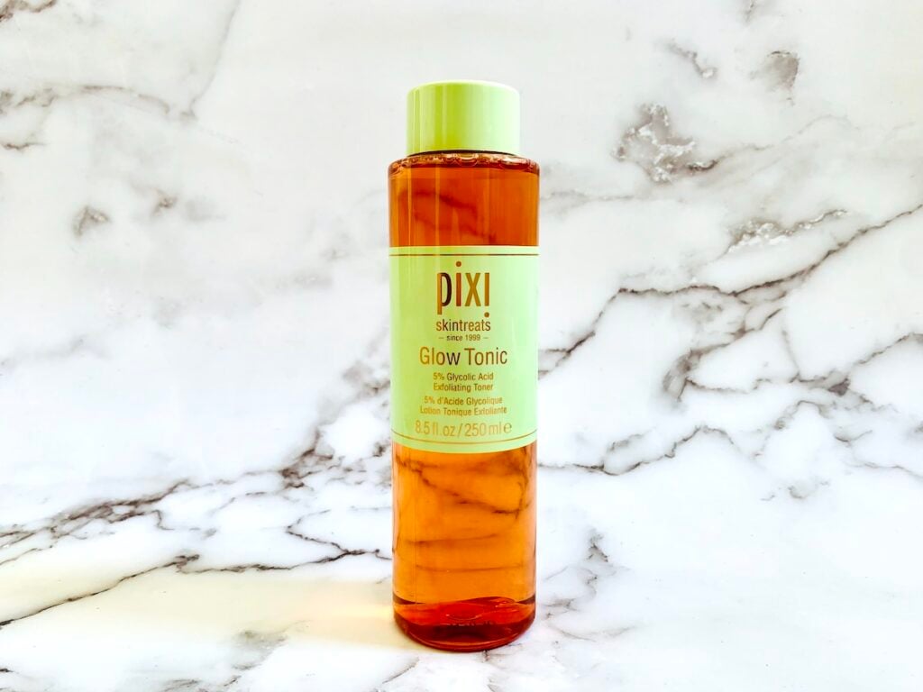 Pixi Glow Tonic on a marble background