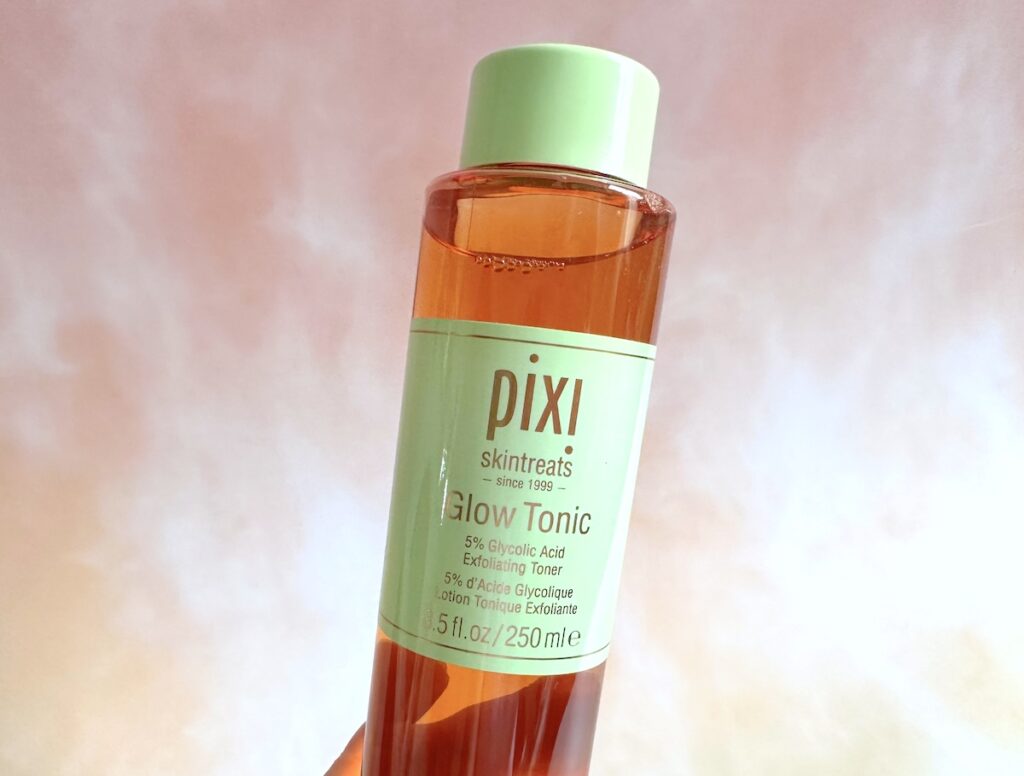 Pixi Glow Tonic 5% Glycolic Acid Exfoliating Toner, handheld.