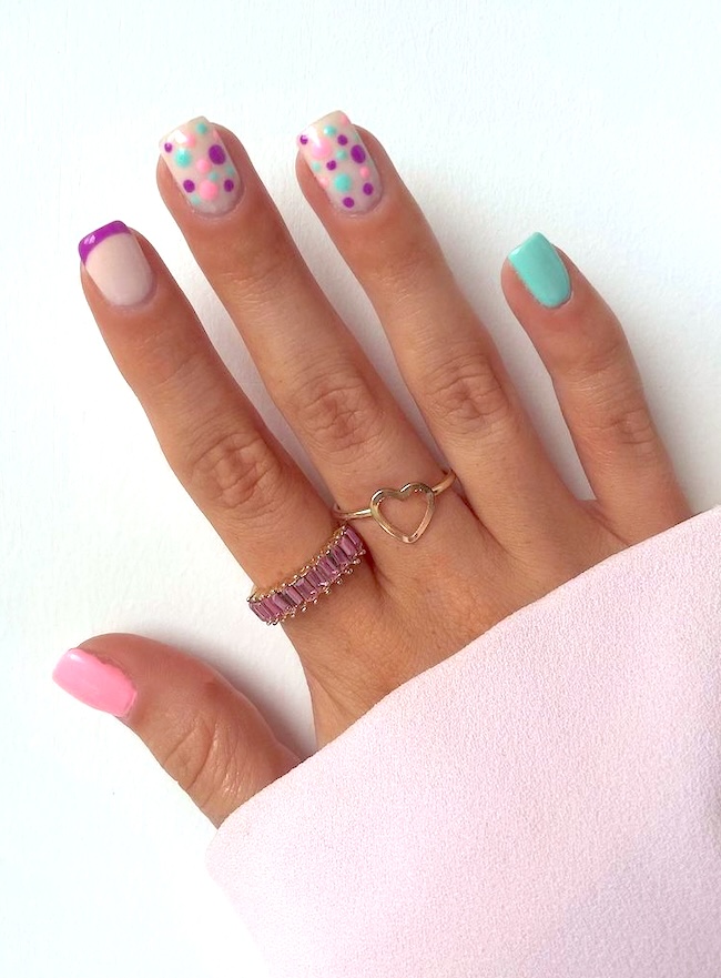 Purple, green, and pink polka-dot summer manicure.