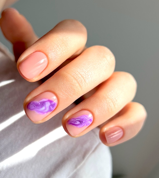 Nude, short, purple marble nails.