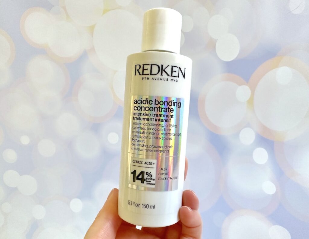 Redken Acidic Bonding Concentrate Intensive Treatment, handheld.