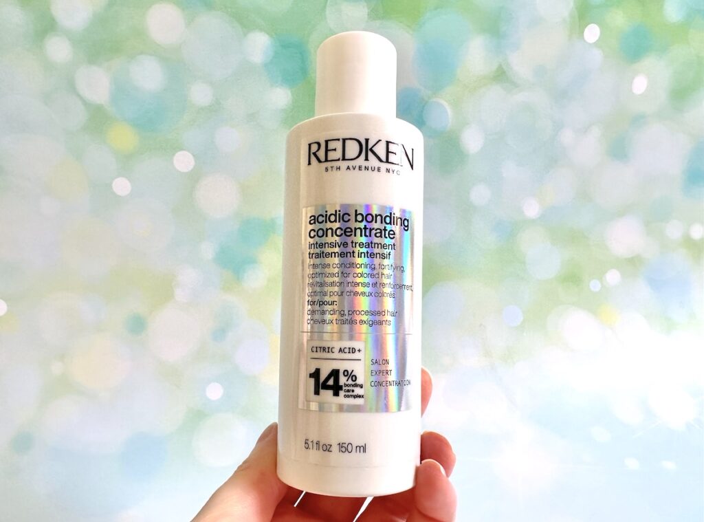 Redken Acidic Bonding Concentrate Intensive Treatment, handheld.