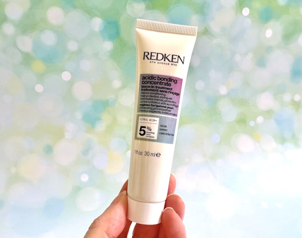 Redken Acidic Bonding Concentrate Leave-in Treatment, handheld.