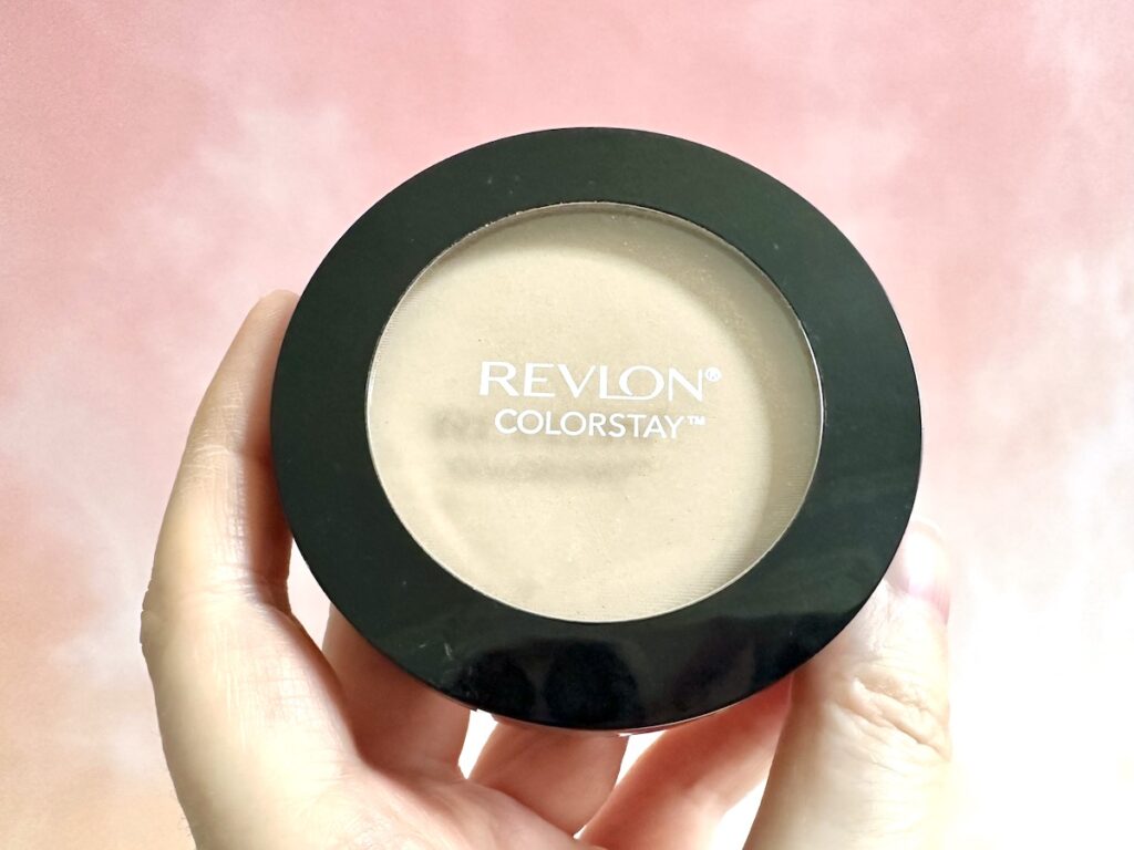 Revlon ColorStay Pressed Powder in the shade Light/Medium, handheld.