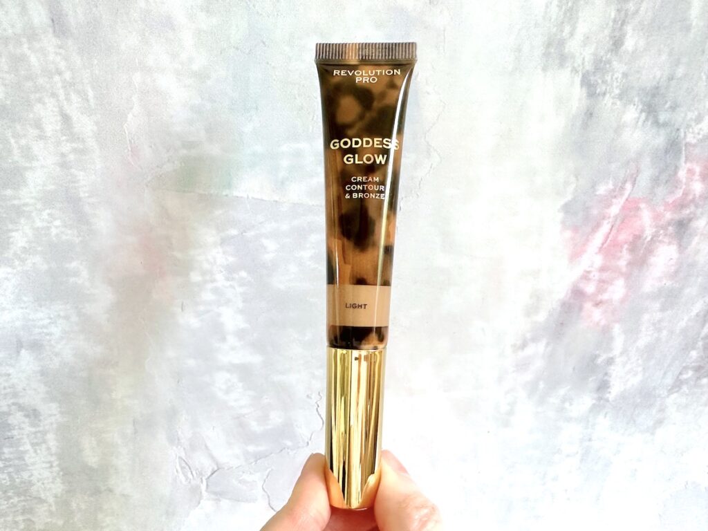 Revolution Pro Goddess Glow Cream Contour & Bronze in the shade Light, handheld.