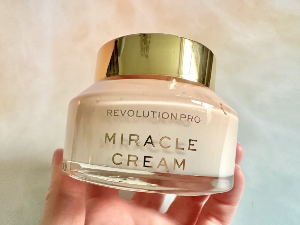 Revolution Pro Miracle Cream, handheld.