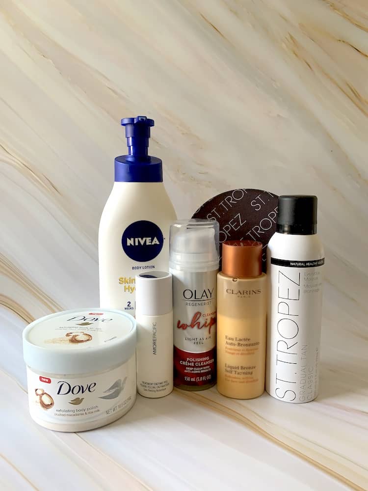 Self Tanning Products - Clarins Liquid Bronze, St Tropez Gradual Tan Classic Mousse, Dove Body Polish, Nivea Body Lotion, Olay Whip Polishing Cleanser, Amore Pacific Treatment Enzyme Peel