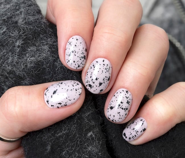 Short speckled white and black eggshell nails.