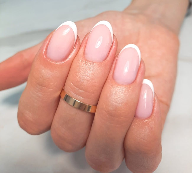 Short French tip manicure.