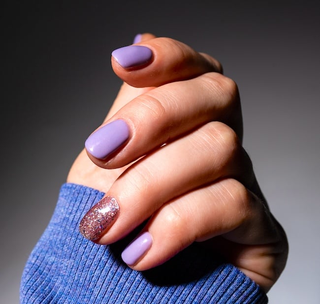 Short lavender sparkle nails.