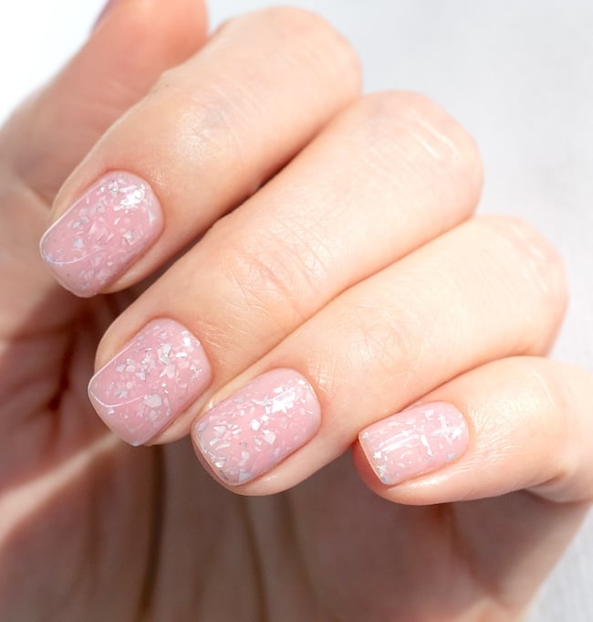 Pink confetti short square nails.