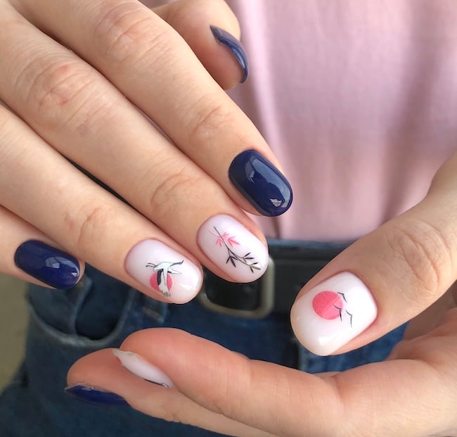 Short white and navy nail art.