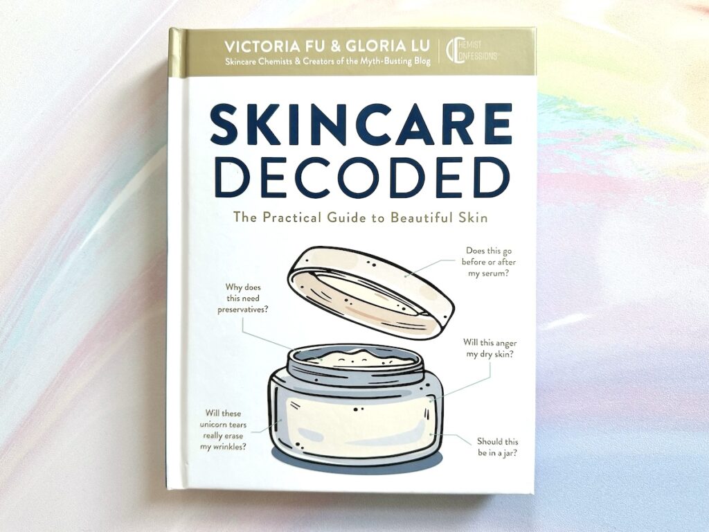 Skincare Decoded: The Practical Guide to Beautiful Skin by Victoria Fu and Gloria Lu, flatlay.