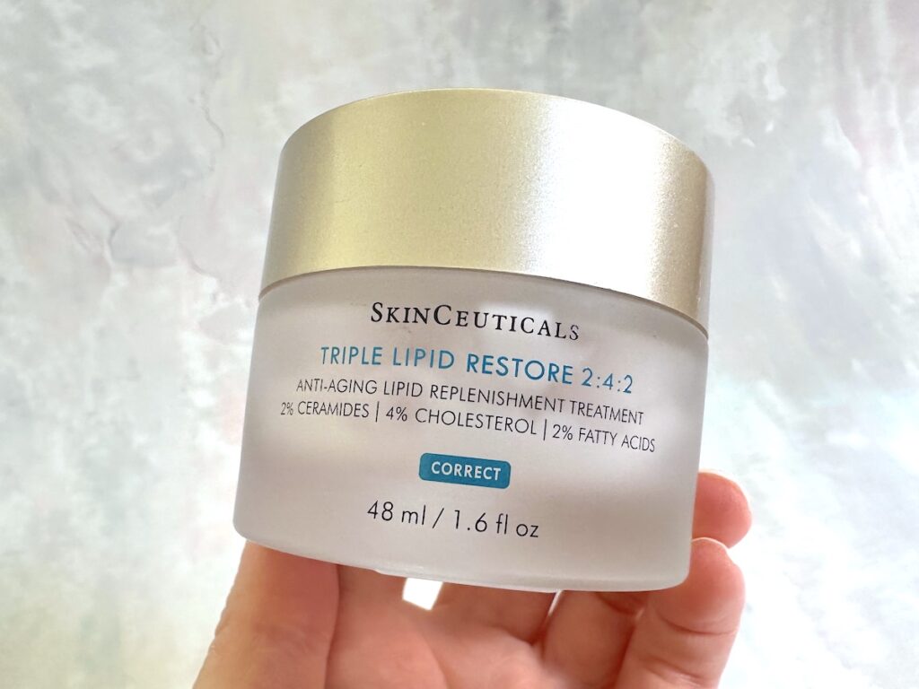 SkinCeuticals Triple Lipid Restore 2:4:2 Anti-Aging Treatment, handheld.