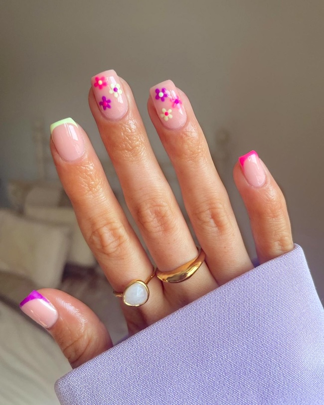 Neon flower nails and colorful French tips.