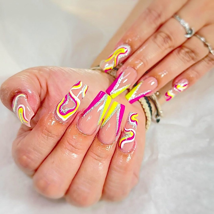 Fuschia pink and yellow summer nails.