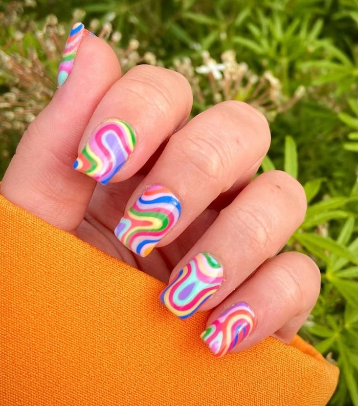 Rainbow swirl nails.