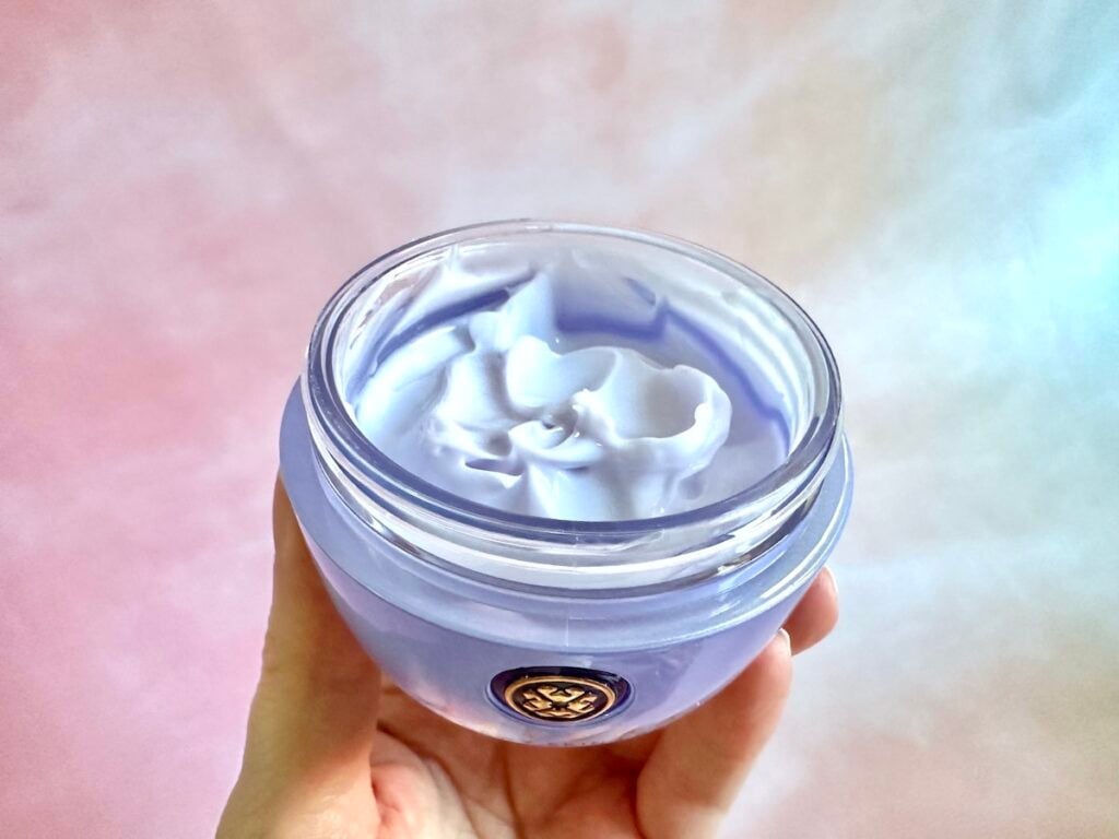 Tatcha The Dewy Skin Cream, open jar, handheld.