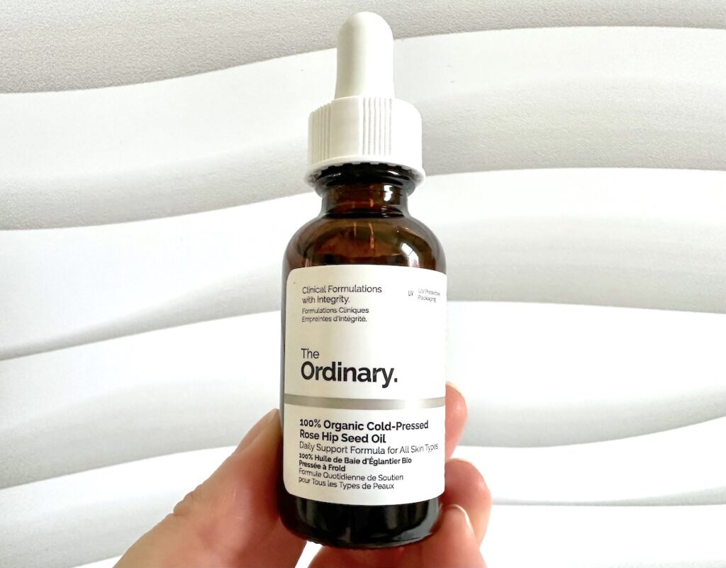 The Ordinary 100% Organic Cold-Pressed Rose Hip Seed Oil, handheld.