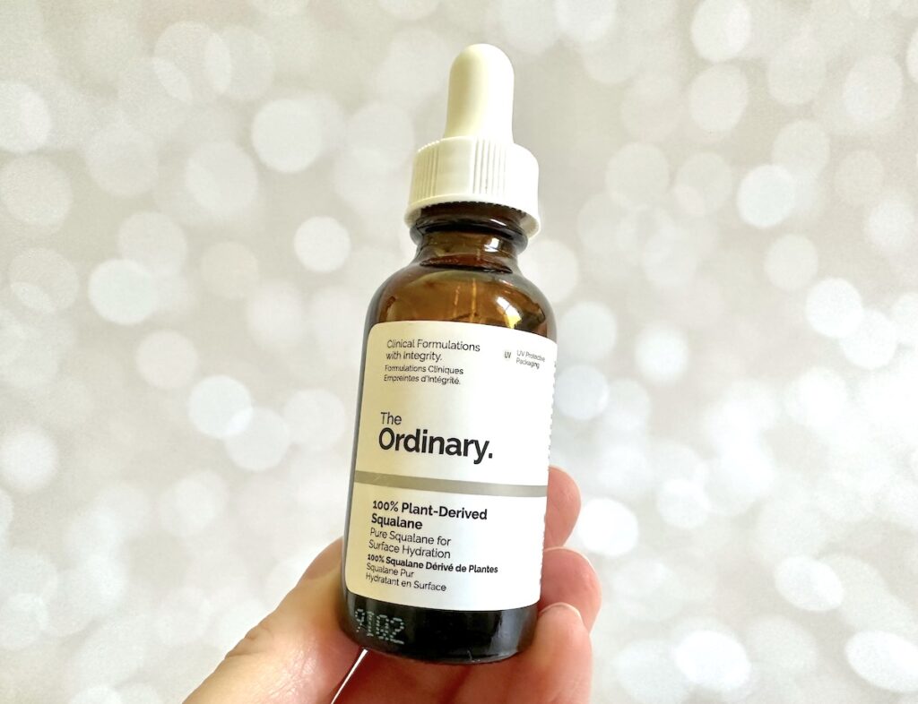 The Ordinary 100% Plant-Derived Squalane, handheld.