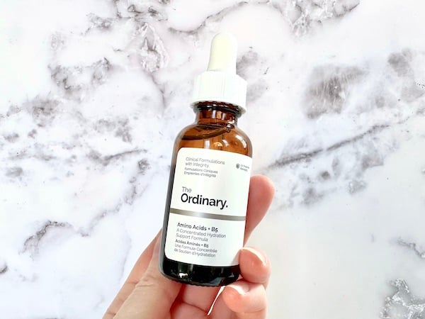 The Ordinary Amino Acids + B5 Serum, handheld.