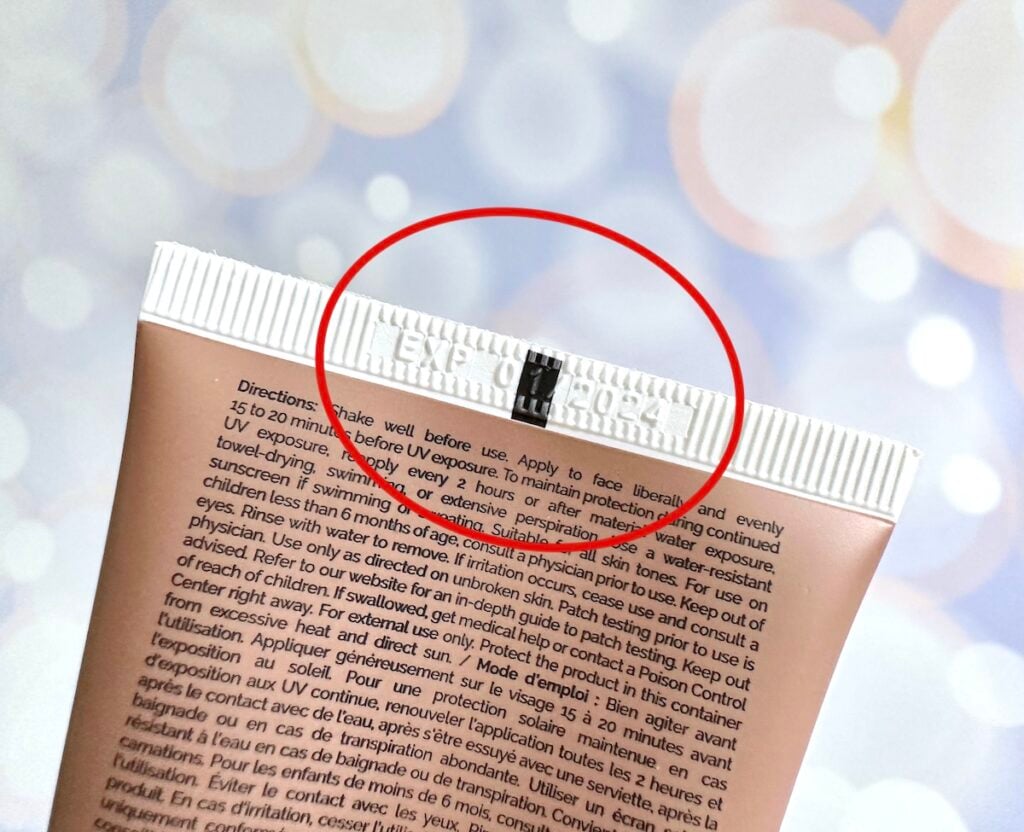 The Ordinary Mineral UV Filters SPF 30 with Antioxidants, with expiration date circled in red near top of tube.