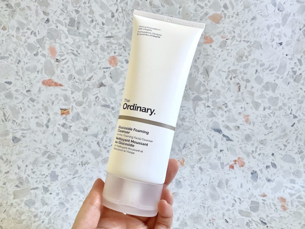 The Ordinary Glucoside Foaming Cleanser handheld.