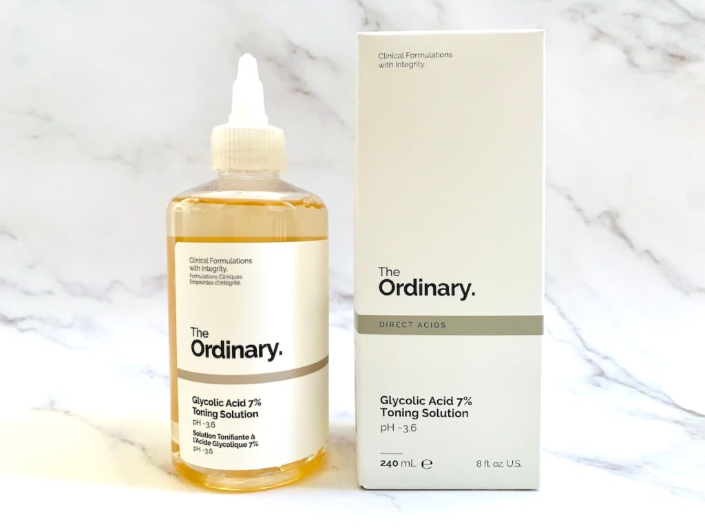 The Ordinary Glycolic Acid 7% Toning Solution and box on white marble background