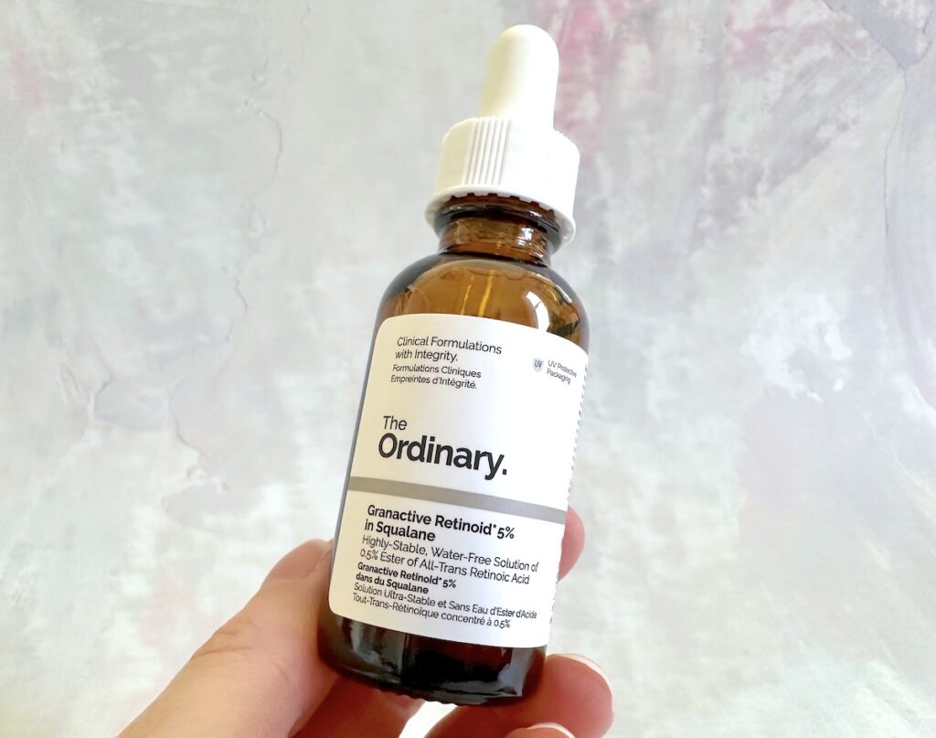 The Ordinary Granactive Retinoid 2% Emulsion, The Ordinary Granactive Retinoid 2% in Squalane, and The Ordinary Granactive Retinoid 5% in Squalane, handheld.