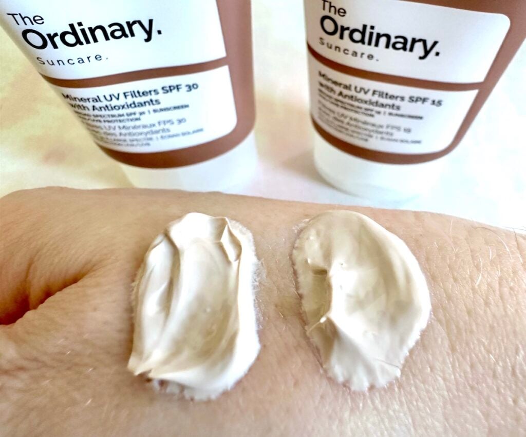 The Ordinary Mineral UV Filters SPF 30 with Antioxidants and The Ordinary Mineral UV Filters SPF 15 with Antioxidants tubes next to samples on hand.