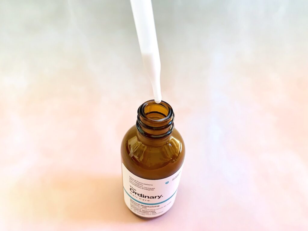 The Ordinary Natural Moisturizing Factors + HA for Scalp opened with dropper