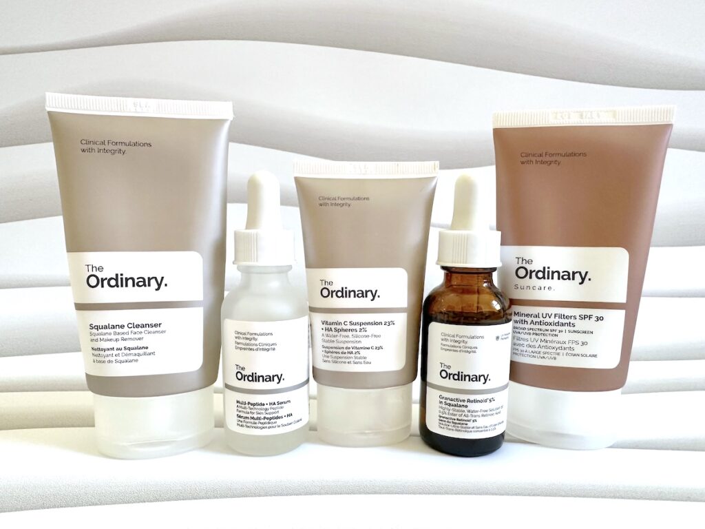 The Ordinary Skincare Routine For Over 50: The Ordinary Squalane Cleanser, Multi-Peptide + HA Serum, Vitamin C Suspension 23% + HA Spheres 2%, The Ordinary Granactive Retinoid 5% in Squalane, and Mineral UV Filters SPF 30 with Antioxidants, handheld.