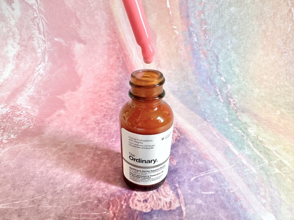 The Ordinary Soothing & Barrier Support Serum, open bottle with pink dropper applicator.