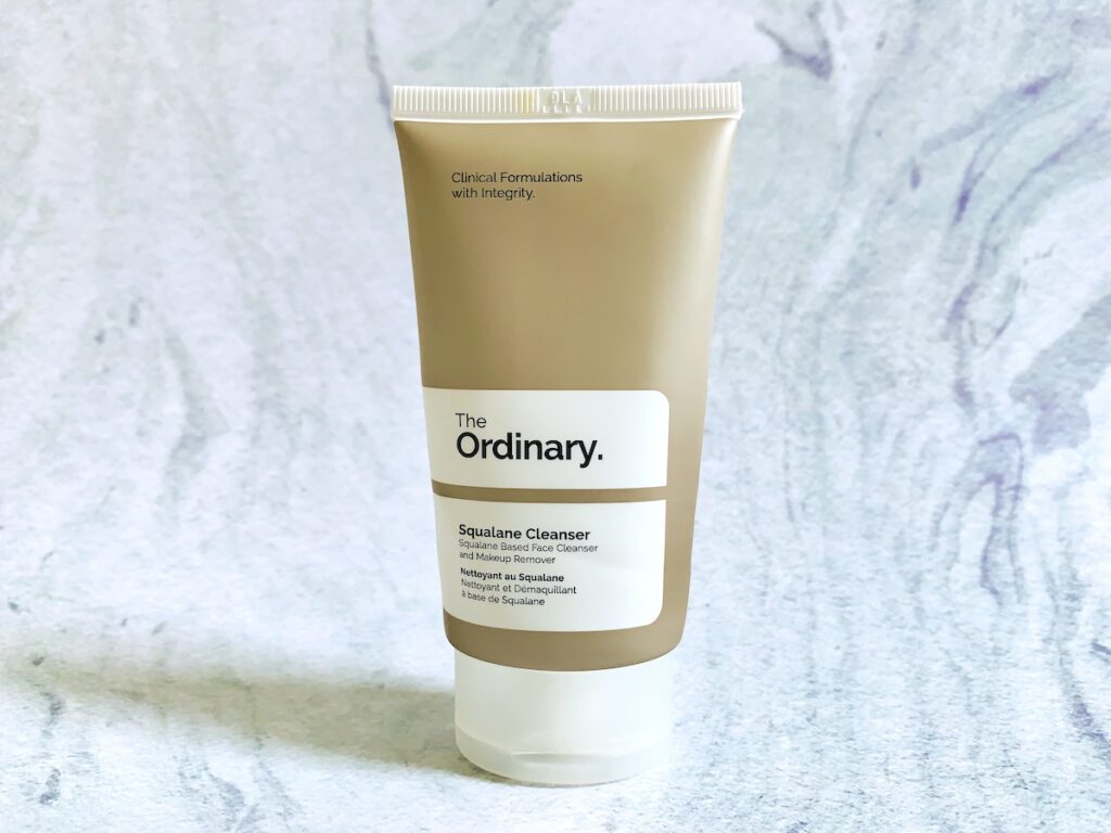 The Ordinary Squalane Cleanser on a blue background.