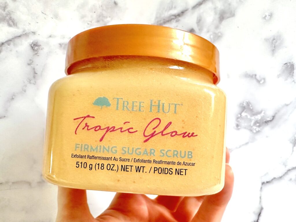 Tree Hut Tropic Glow Firming Sugar Scrub, handheld.